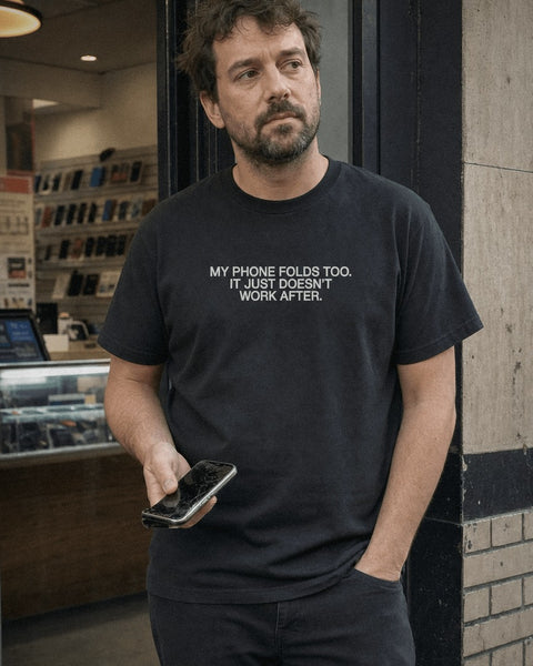 MY PHONE FOLDS TOO. IT JUST DOESN’T WORK AFTER. Black Tee